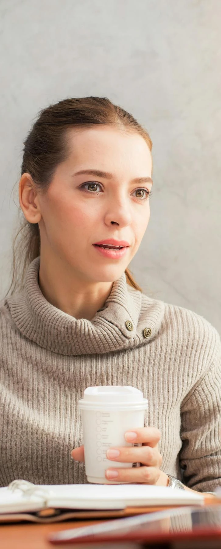 Woman contemplating | The best ways to gather employee feedback