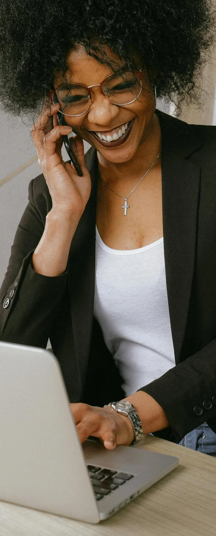 A professional woman smiling and speaking on the phone | Securing a new job